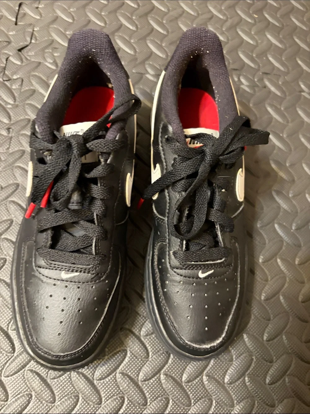 Nike Air Force 1 Low Kids Black Sneakers with White Swoosh and Red Interior